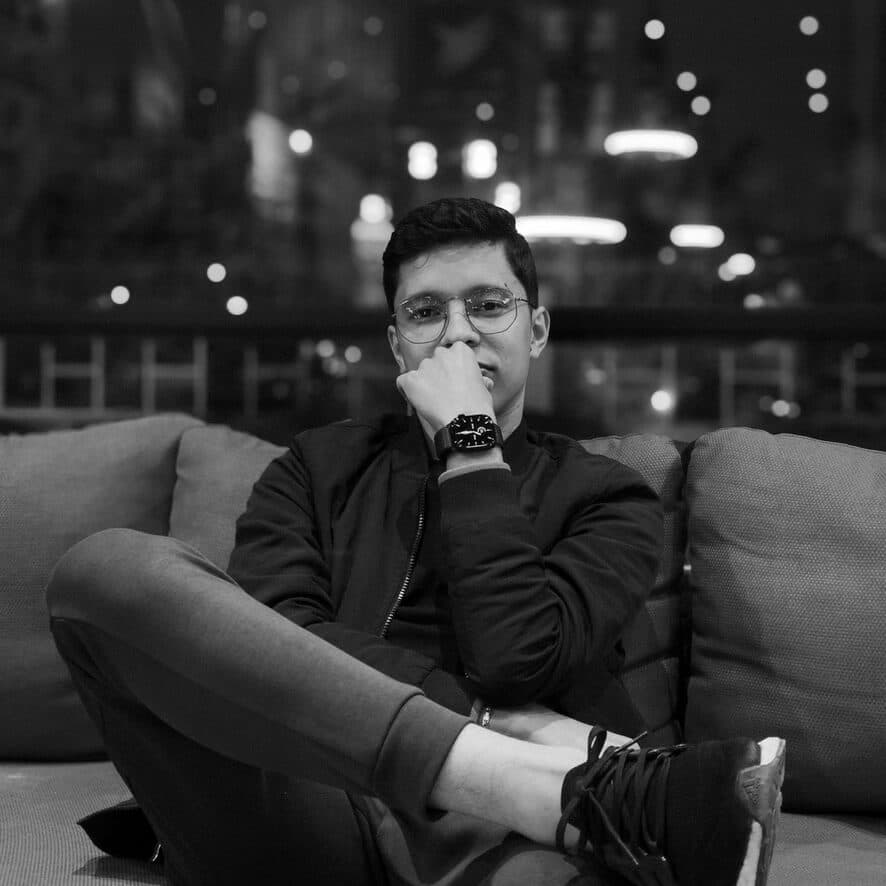 A photo of me in a cafe, looking at the camera with a smile.